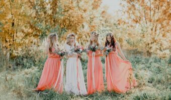 beautiful bridesmaids wearing coral bridesmaid dress colors