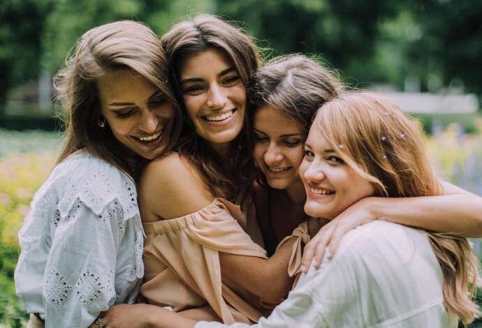 bride and bridesmaids hug while at bachelorette wellness retreat