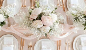 beautiful wedding table with babys breath and large flowers