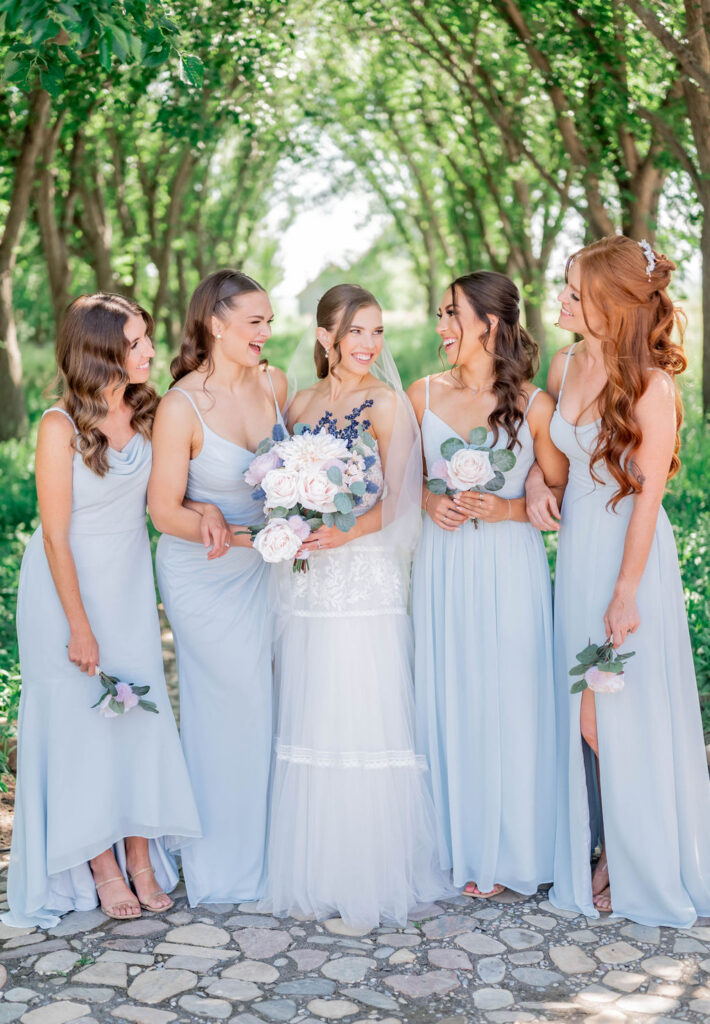 Nadine Mckenney Photography bride with bridesmaids in outside canopy of trees