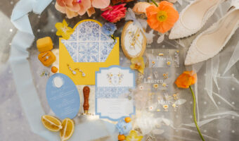 colourful Mediterranean-inspired wedding flatlay with invitations