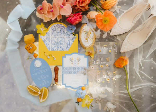 colourful Mediterranean-inspired wedding flatlay with invitations