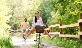 pre wedding workouts riding bike together in the countryside