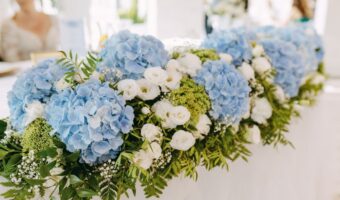 gorgeous hydrangea table runner with greenery and white flowers beautiful spring wedding flowers