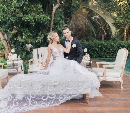 beautiful bride sitting with groom in Riviera Maya at destination wedding