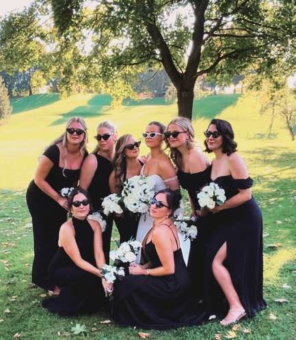 group of bridesmaids and bride after stress-free wedding planning