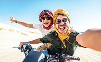 couple on motorbike in desert on megamoon