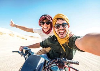 couple on motorbike in desert on megamoon