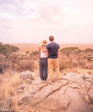 couple standing in desert on megamoon adventure