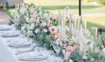 beautiful wedding flowers on reception table at romantic garden wedding