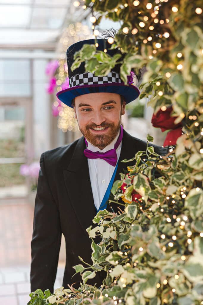 groom styled as Mad Hatter in alice in wonderland wedding