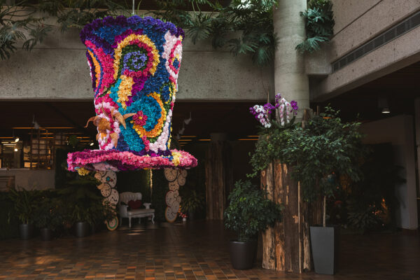 floating whimsical top hat at Alice in Wonderland-themed wedding
