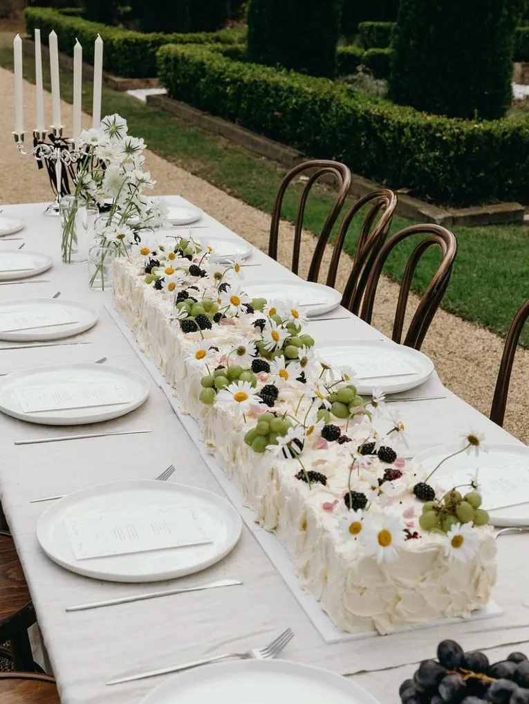 table long wedding sheet cake at outdoor summer wedding cake trends