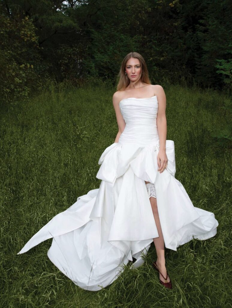 bride wearing white wedding dress with dramatic skirt in forrest editorial shoot