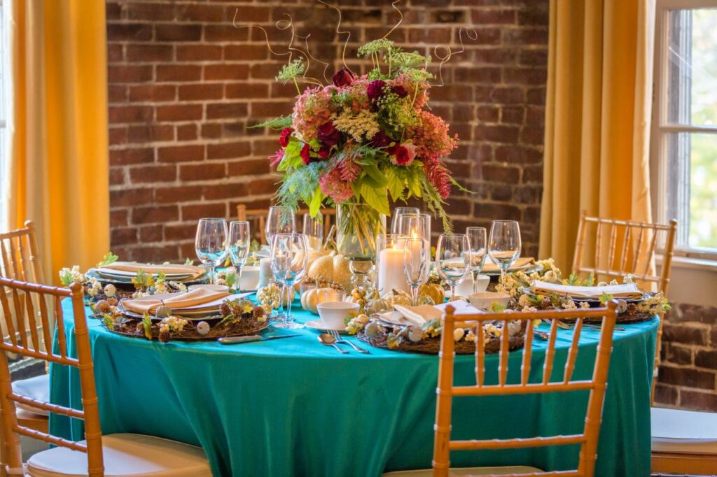 vibrant fall wedding trend teal wedding decor with colourful accents of pink and bright green