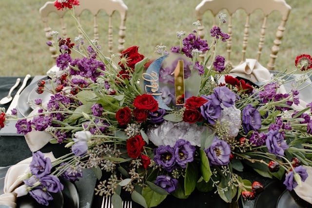 stunning wedding flower arrangement on table paid by parents after deciding wedding expenses