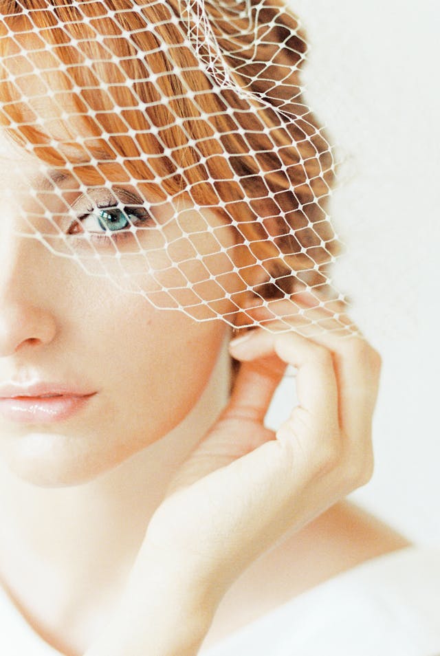 vintage wedding style bride wearing birdcage veil styls