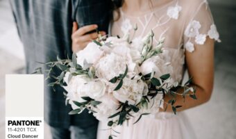 bride holding white bridal bouquet in 2026 Pantone colour of the year
