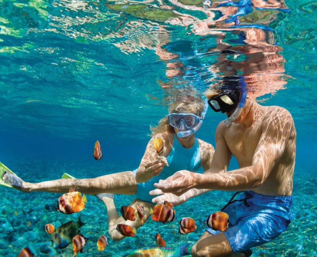 destination wedding in Caribbean couple snorkels