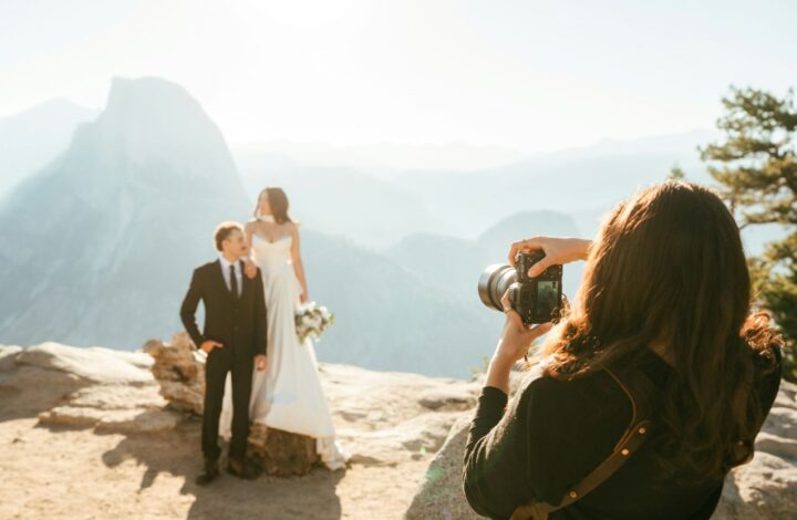 newlyweds pose for portrait next to canyon in the mountains wedding tips