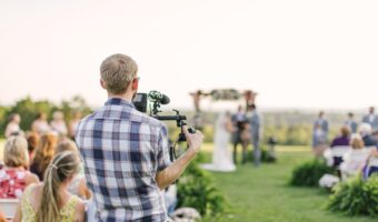 man filming wedding ceremony outdoor wedding videography styles