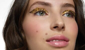 bride showing wedding makeup trend of metallic eyeshadow