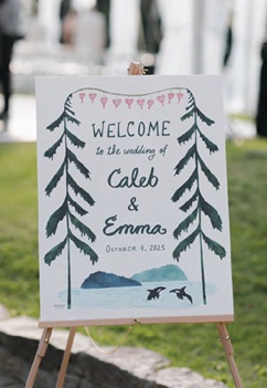 mountain wedding welcome sign at sustainable wedding outdoors
