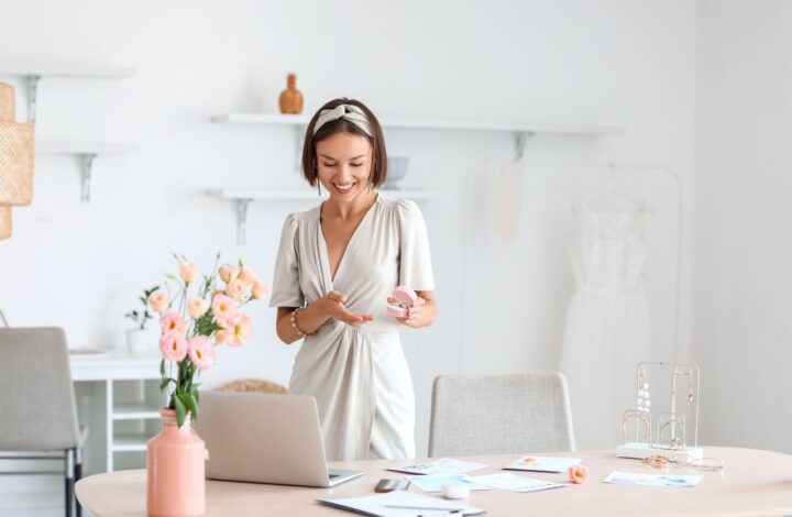 woman standing in office using wedding planning checklist to work out details