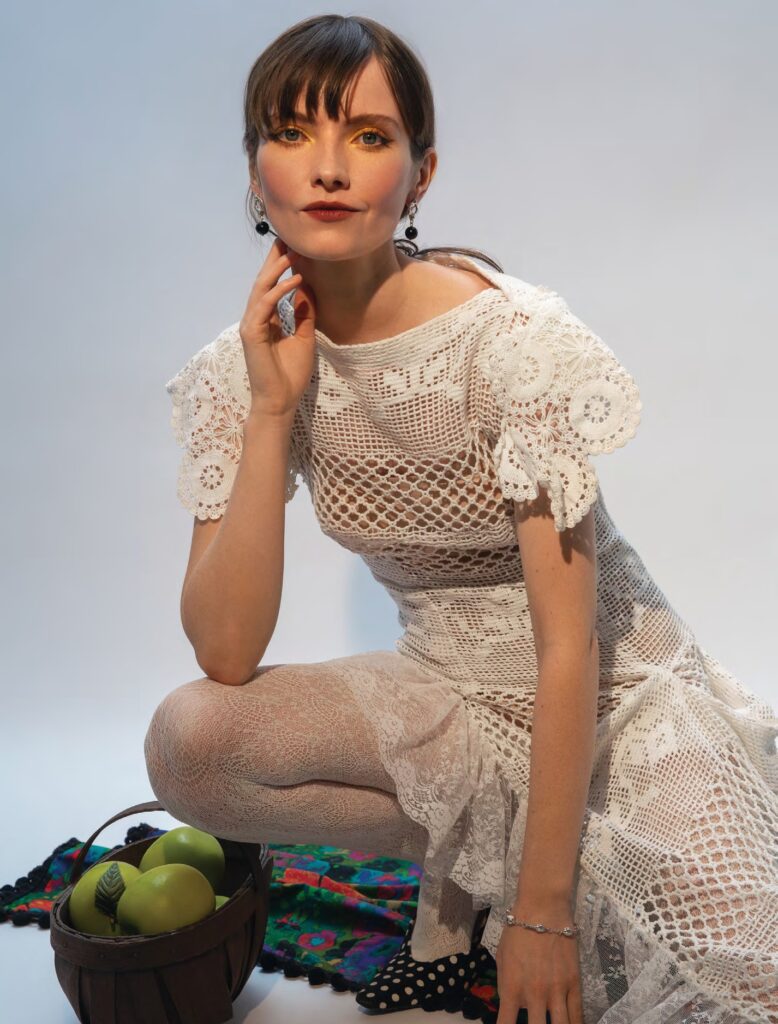 woman wearing free-spirted crochet dress