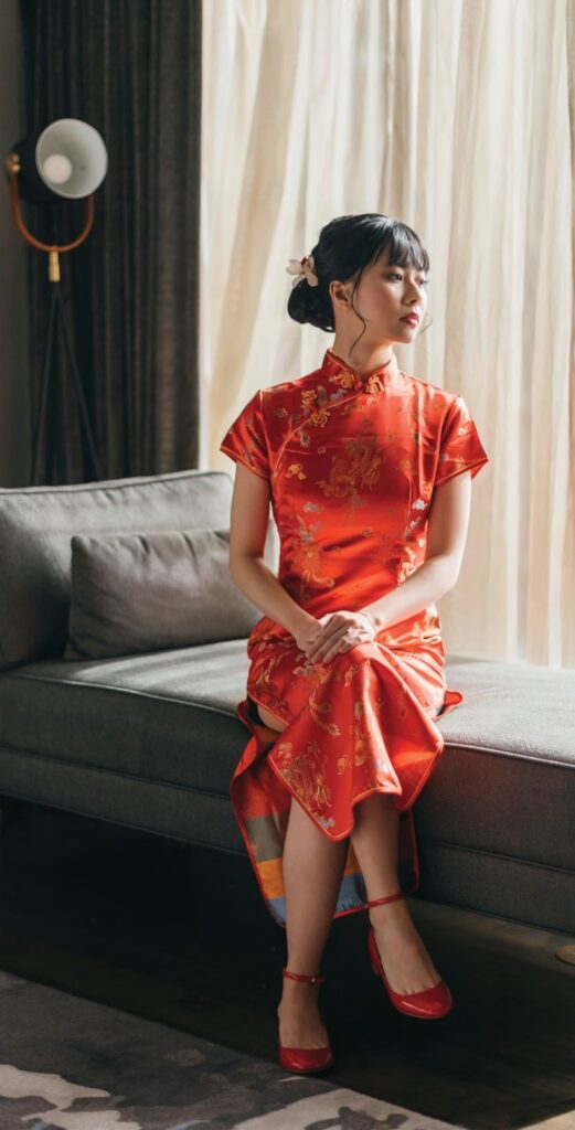 bridal portrait sitting in Chinese wedding dress during modern Chinese wedding