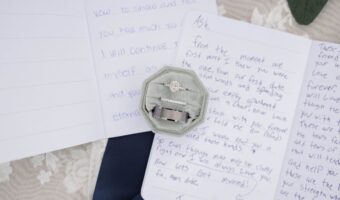wedding flatlay handwritten wedding vows with ring box