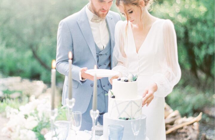 soft and airy photo of bride and groom at cake table after wedding cake questions answered