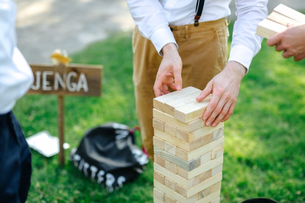 men playing jenga at fun wedding cocktail hour