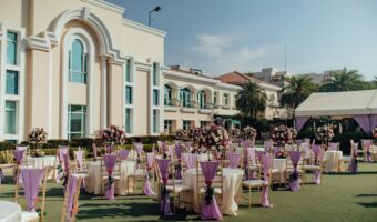luxurious wedding reception setup outside large chateau after learning wedding venue costs