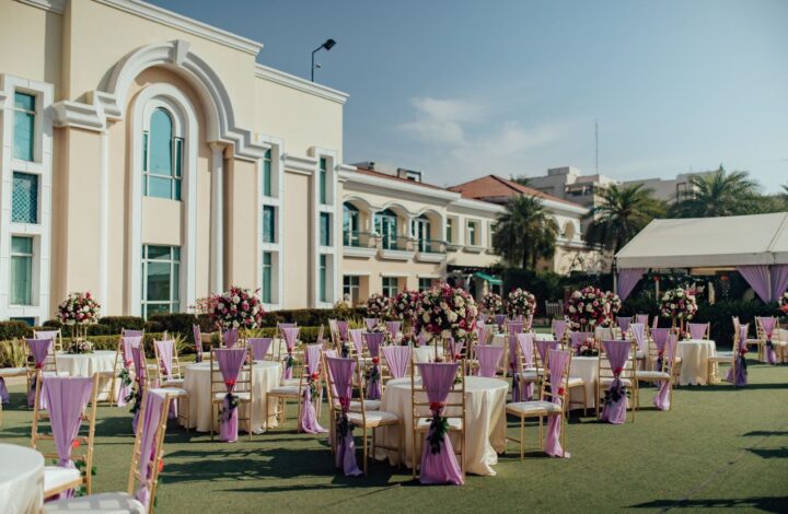 luxurious wedding reception setup outside large chateau after learning wedding venue costs