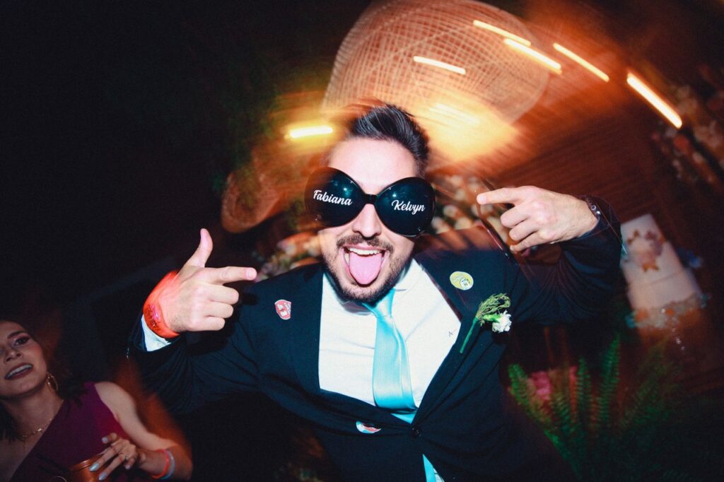 guy at wedding with oversized black sunglasses