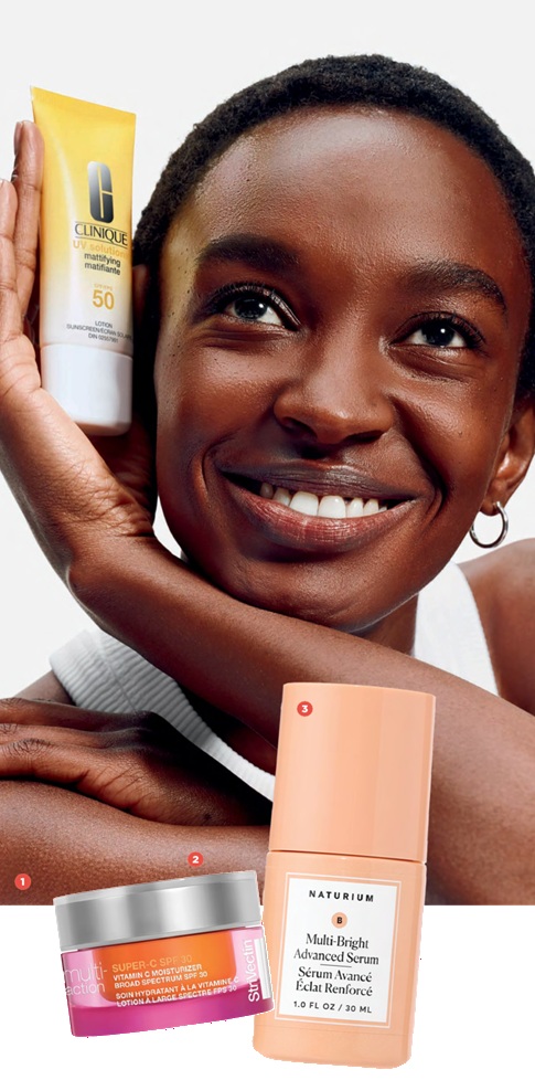 Smiling Black woman posing with a Clinique SPF 50 sunscreen tube and pink/orange skincare products in front (image advert).