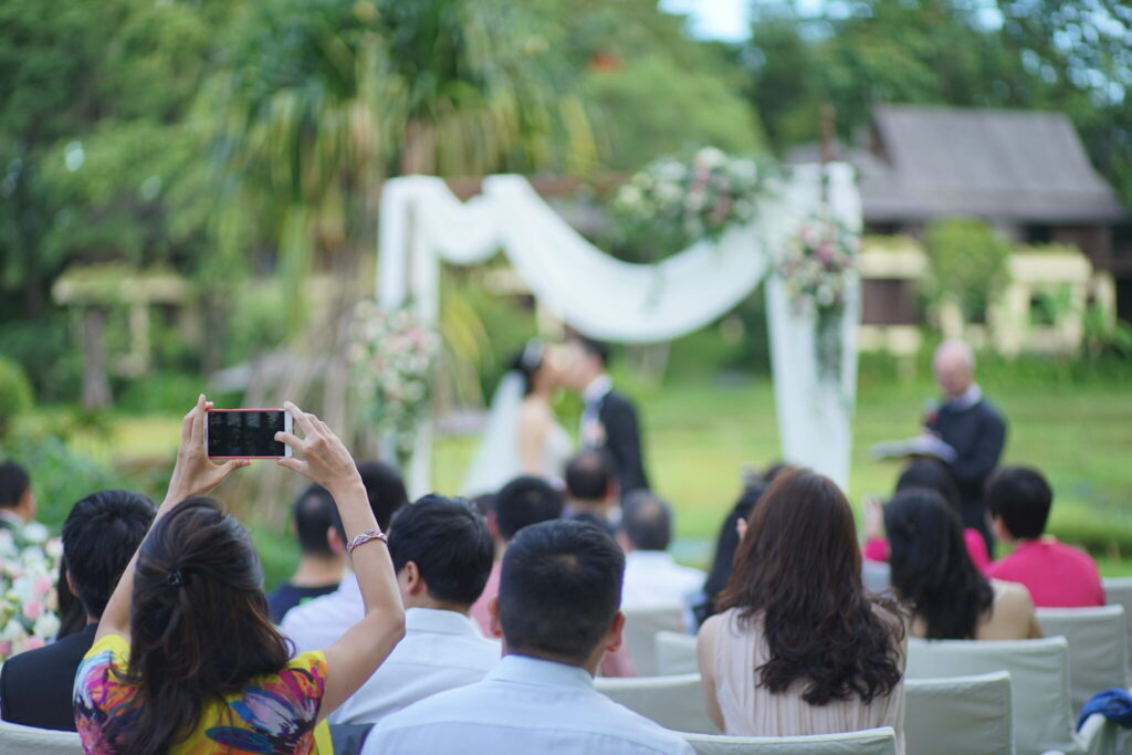 bride and groom get bombarded by wedding guests with mobile phones because they didn't do unplugged wedding