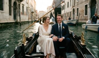bride and groom in gondola laughing on their Italy elopement