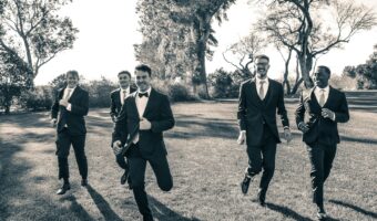groomsmen duties include creating memorable portraits like running with the groom