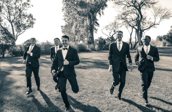 groomsmen duties include creating memorable portraits like running with the groom