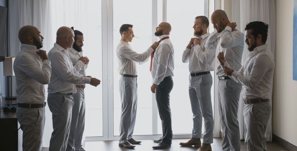 groomsmen duties include helping groom get dressed